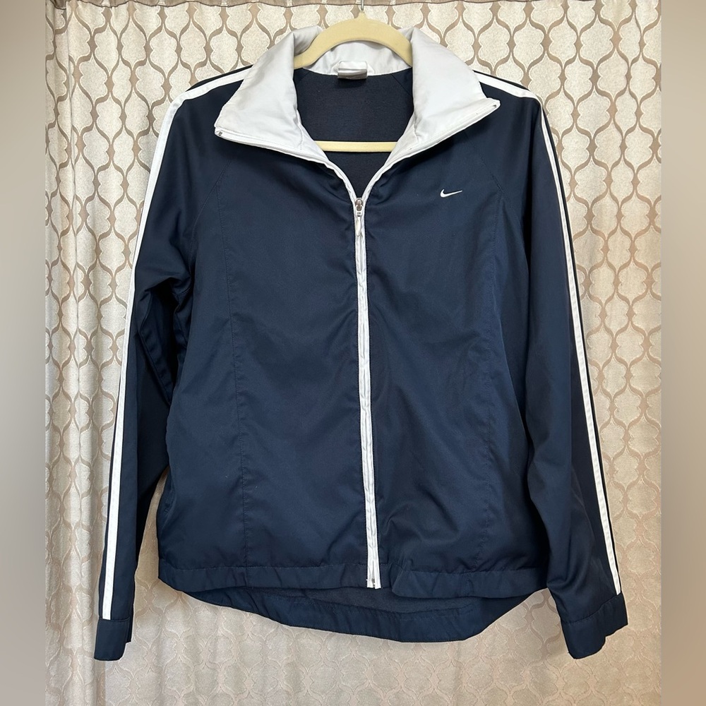 Nike women’s jacket.  Size Medium. Black with white accent color.